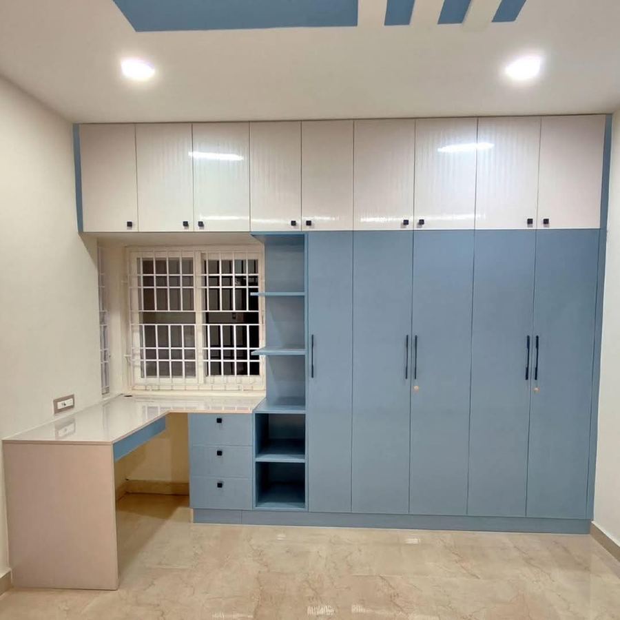 Blue bedroom wardrobe with matching built-in study table