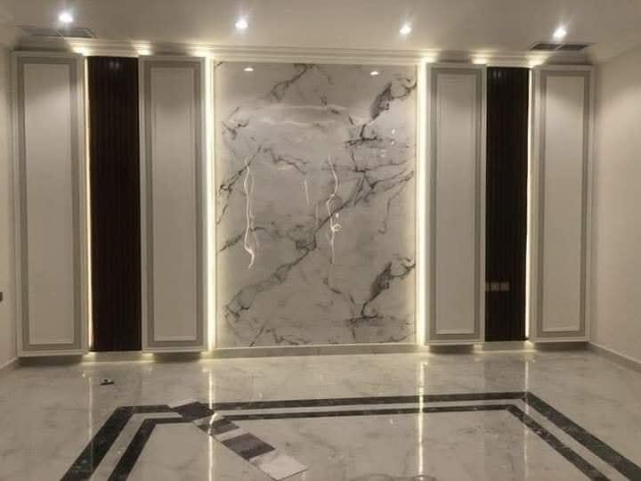 Marble-finish entrance wall panelling with inlay flooring