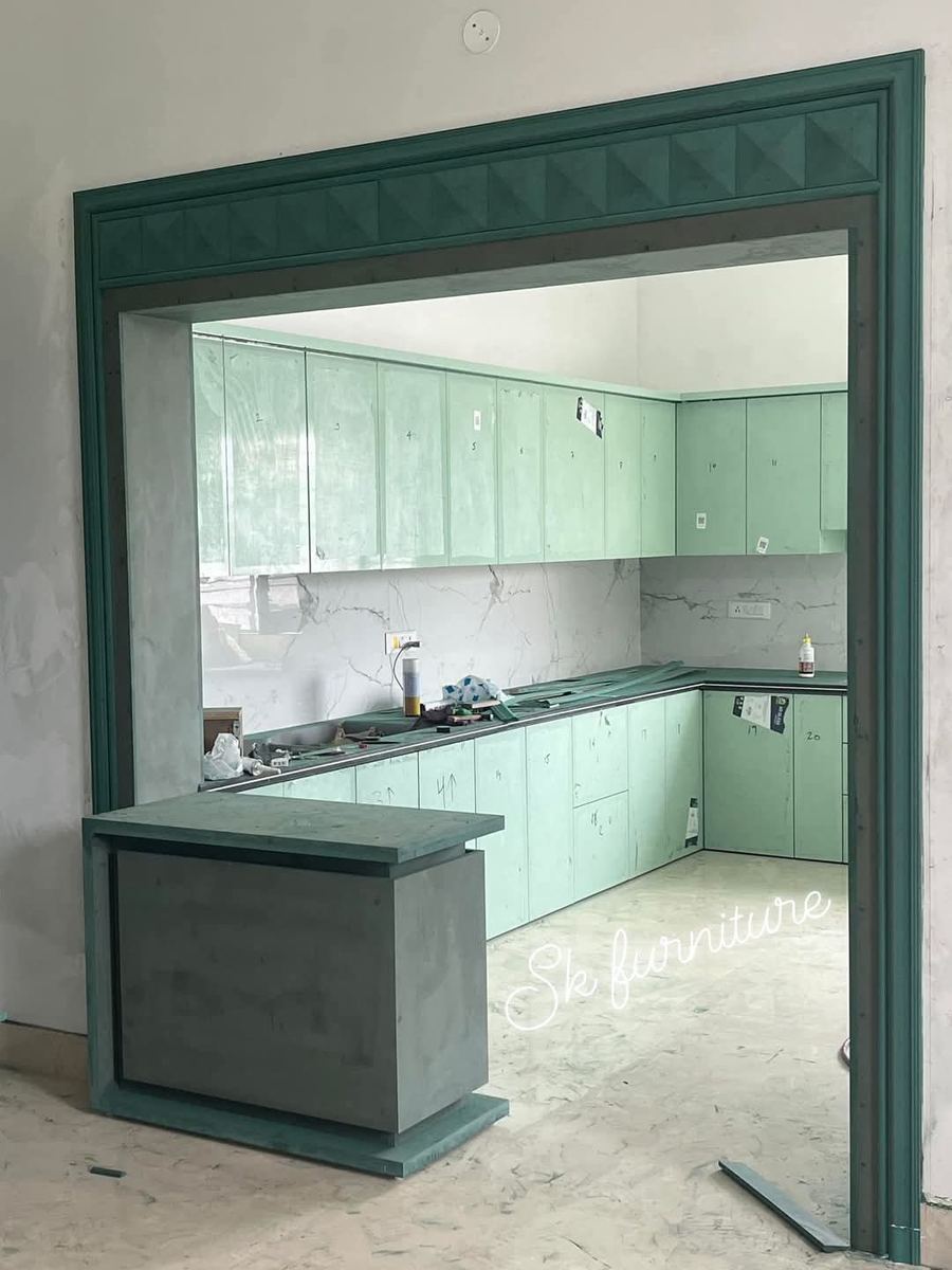 Mint green L-shaped modular kitchen with island counter