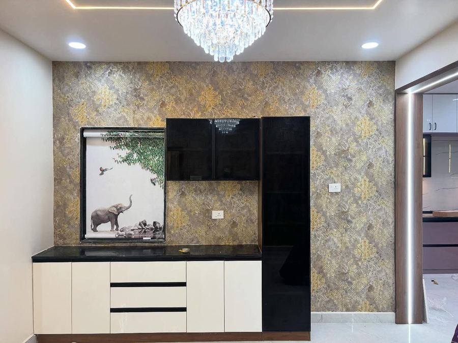 Modular kitchen with patterned wallpaper and black granite counter