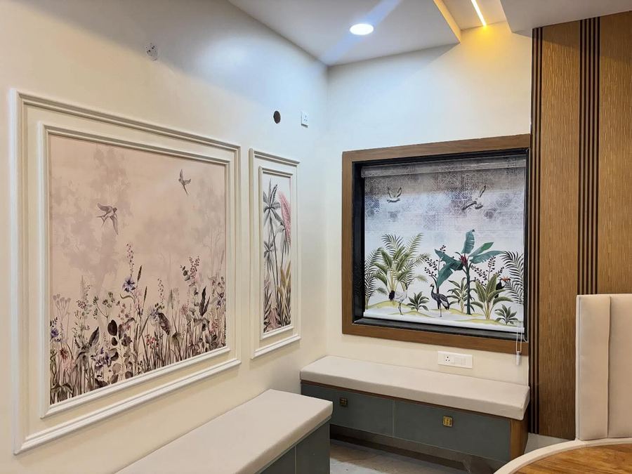 Living room wall with framed botanical art panels and bench seating