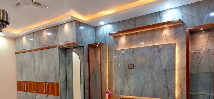 Stepped POP false ceiling with concealed cove lighting and recessed spotlights