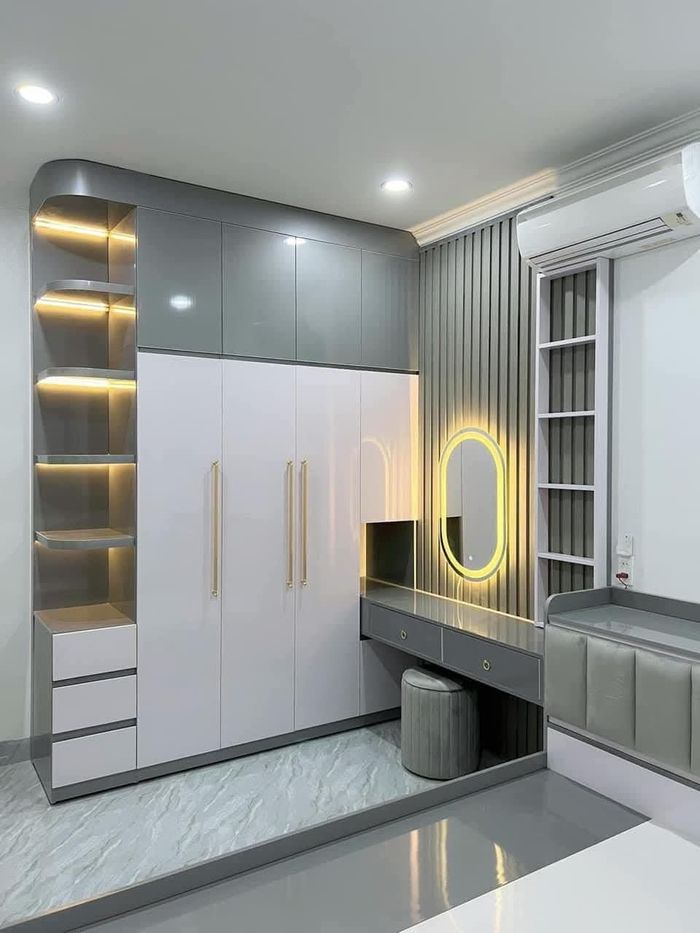 Grey and white modular wardrobe with dressing table and backlit oval mirror